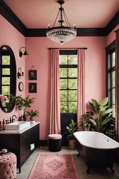 a bathroom with pink walls and black trim