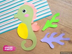 paper seahorses are cut out and placed on the floor next to each other