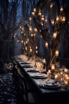 a long table is set with candles and place settings for an outdoor dinner in the woods