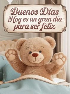 a brown teddy bear sitting on top of a bed next to a sign that says, buenos dias hoy es un grana da para se felix