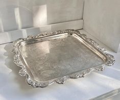 a silver tray sitting on top of a white counter