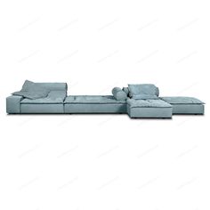 a blue sectional sofa with pillows on the top and bottom, in front of a white background