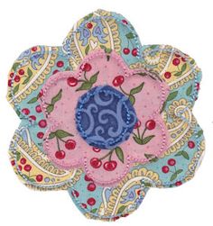 an embroidered flower with blue and pink accents