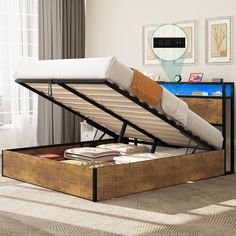 the bed frame is made out of wood and has a mattress on top of it