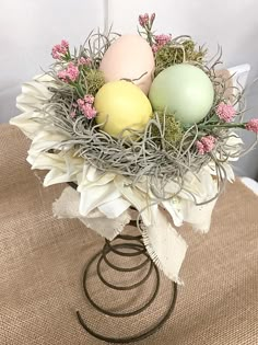 a vase filled with eggs sitting on top of a table