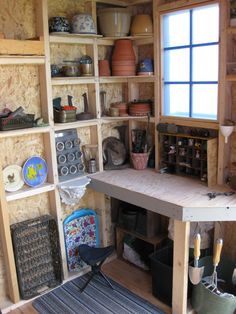 a room filled with lots of wooden shelves