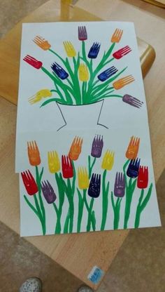 a child's drawing of flowers on paper