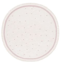 a round rug with white and pink dots on the bottom, in front of a white background