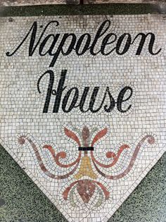 a mosaic tile sign with the words nappleon house on it