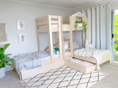 a bedroom with two bunk beds and a rug in front of the bed is an open sliding glass door