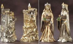 three gold figurines are standing next to each other