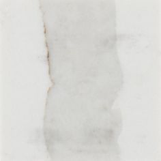 a piece of white marble with brown streaks