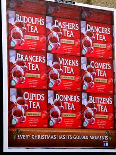 a large poster advertising cups of tea on the side of a building in front of a wall