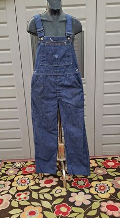 Cute pair of Vintage 60's-70's  Sears denim Overalls.  Distressed dark blue & paint stains scattered around .  So Cool looking.   Nicely broken in . They have adjustable shoulder straps and  a zipper fly.  Poly Cotton Blend (non stretch) Measurements are taken with item laying flat so widths across must be doubled  Length = 51.5 in   in (measured without the straps, from the top of bib down to leg hems) Across the Waist = 18  in Across the Hips =  21.5   in Across Leg Opening = 9.5  in Inseam = Dark Blue Paint, Painted Denim, Overalls Women, Paint Stain, Denim Overalls, Dark Denim, Blue Paint, Dark Blue, Overalls