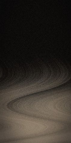 a black and white photo of sand dunes at night