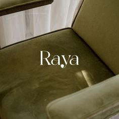 a green chair with the word raya on it