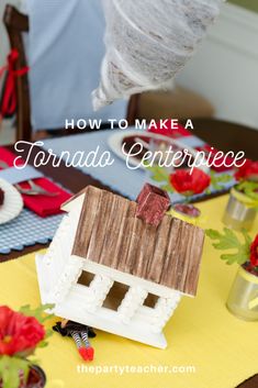 a doll house sitting on top of a table next to plates and napkins with the words how to make a tornado centerpiece