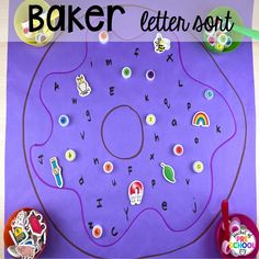 a paper plate with letters and numbers on it, next to some other items for making a letter sort