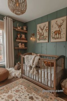 a baby's room with green walls and pictures on the wall, including a crib