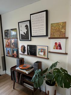 there are many framed pictures on the wall