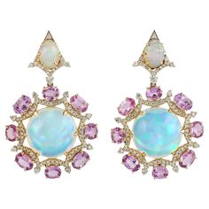 Cast in 18 karat gold, these exquisite earrings are hand set with 17.72 carats Ethiopian opal, 7.1 carats sapphire and 1.12 carats of glimmering diamonds. FOLLOW MEGHNA JEWELS storefront to view the latest collection & exclusive pieces. Meghna Jewels is proudly rated as a Top Seller on 1stDibs with 5 star customer reviews. All items manufactured by us are handmade and can be customized or redesigned. Composition Size - 43X27 MM Gold Weight - 9.938 gm Gemstone - Opal Ethiopian (17.72 Ct), Sapphire (7.1 Ct) Diamond Weight - 1.12 Ct Gross Weight - 15.127 gm Opal Earring, Kelly Rutherford, Jewelry Wishlist, Gemstones Jewelry, Opal Earrings, Gold Drop Earrings, Top Seller, Opal Jewelry, 1 Carat