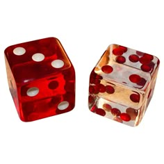 two red and white dices sitting side by side