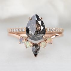 an engagement ring with two pear shaped diamonds