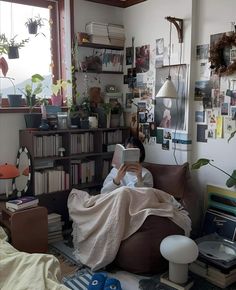 a person laying in bed reading a book