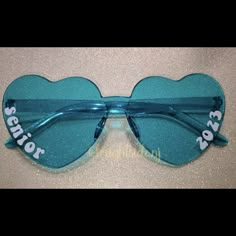 a pair of heart shaped sunglasses with the words senior on them