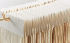 a close up of an open book with strings attached to the front and back cover