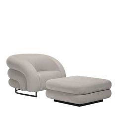 a white chair and ottoman sitting next to each other