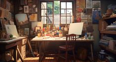 an artist's studio with lots of art supplies on the desk and in the window