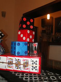 a stack of playing cards and dices sitting on top of each other in front of a mirror