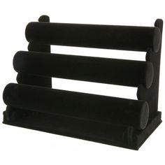 three tiered black rack with round holes