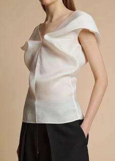 The Ami Top in Chalk– KHAITE Spring Silk Off-shoulder Blouse, Off-shoulder Silk Blouse For Spring, Elegant Evening Top With Open Neckline, Spring Silk Top With Asymmetrical Neckline, Silk Top With Asymmetrical Neckline For Spring, Chic Silk Blouse For Evening, Silk Top With Asymmetrical Neckline For Party, Luxury Silk Top For Evening, Luxury Silk Evening Top