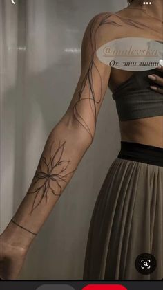 a woman with a tattoo on her arm