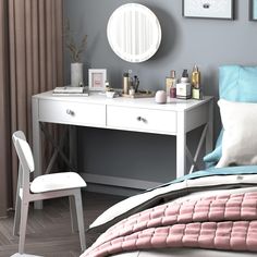 a bedroom with a desk, mirror and chair in it's corner next to the bed