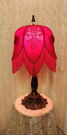 a pink lamp on top of a table