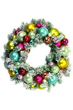 a christmas wreath with ornaments hanging from it