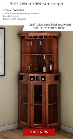 a wooden cabinet with wine glasses on it and a red sign that says shop now