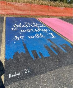 the sidewalk has been painted with words on it