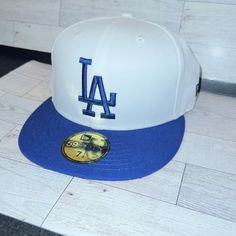 Bright White And Royal Blue La Dodgers Hat Size 7 1/8 Nwt Never Worn White Curved Brim Hat For Baseball Season, White Visor Hat For Baseball Season, White Casual Fitted Hat With Curved Brim, Casual White Fitted Hat With Curved Brim, White Visor For Baseball Season, White Flat Brim Casual Fitted Hat, Casual White Visor Fitted Hat, Classic White Fitted Hat For Baseball Season, White Flat Brim Fitted Hat For Baseball Season