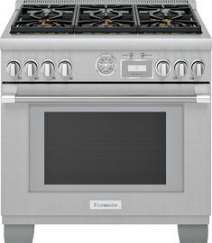 a stainless steel stove with four burners and two oven doors on the front side