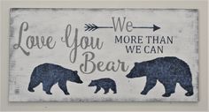 a wooden sign that says, love you more than we can bear with two bears