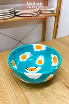 a bowl sitting on top of a wooden table