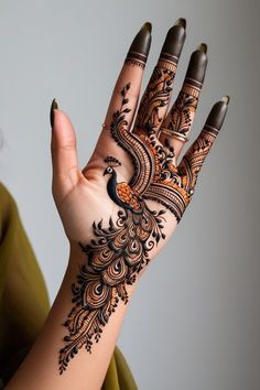 a woman's hand with henna on it