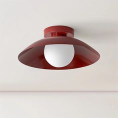 a red light hanging from the ceiling in a room