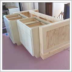 the kitchen island is made out of wood and has been built with cabinets in it