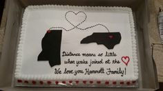 a cake in the shape of a state with hearts and words on it that says distance means at little when you're joined at the heart, we love you, vermont, family