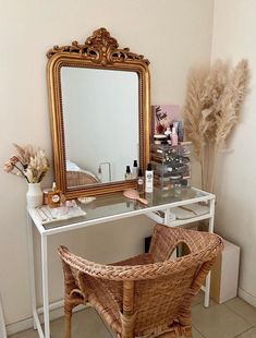 a wicker chair sitting in front of a mirror on top of a white desk